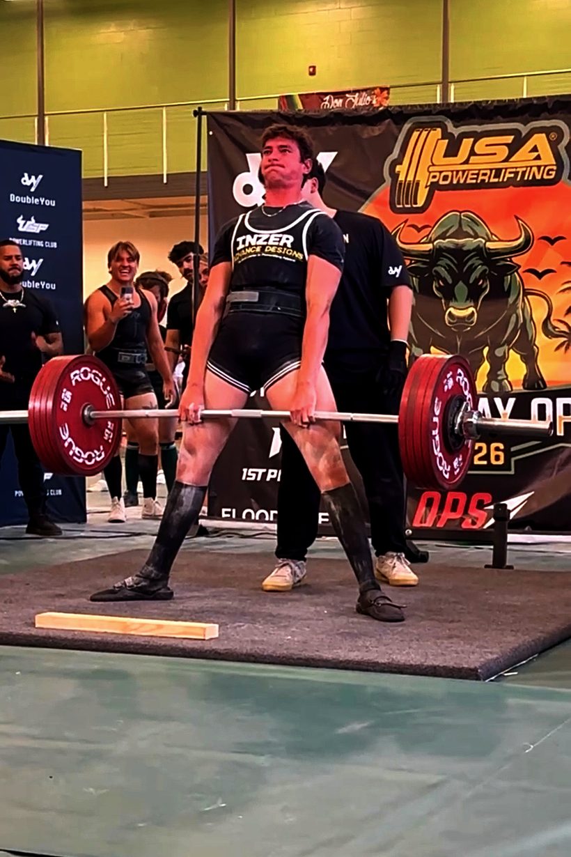 Aaron Akouka locking out a deadlift on the platform