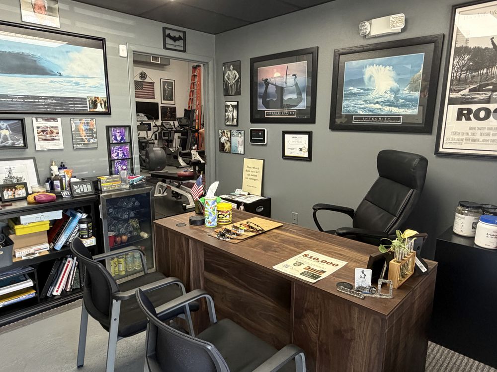 The consultation office desk and the Rocky poster